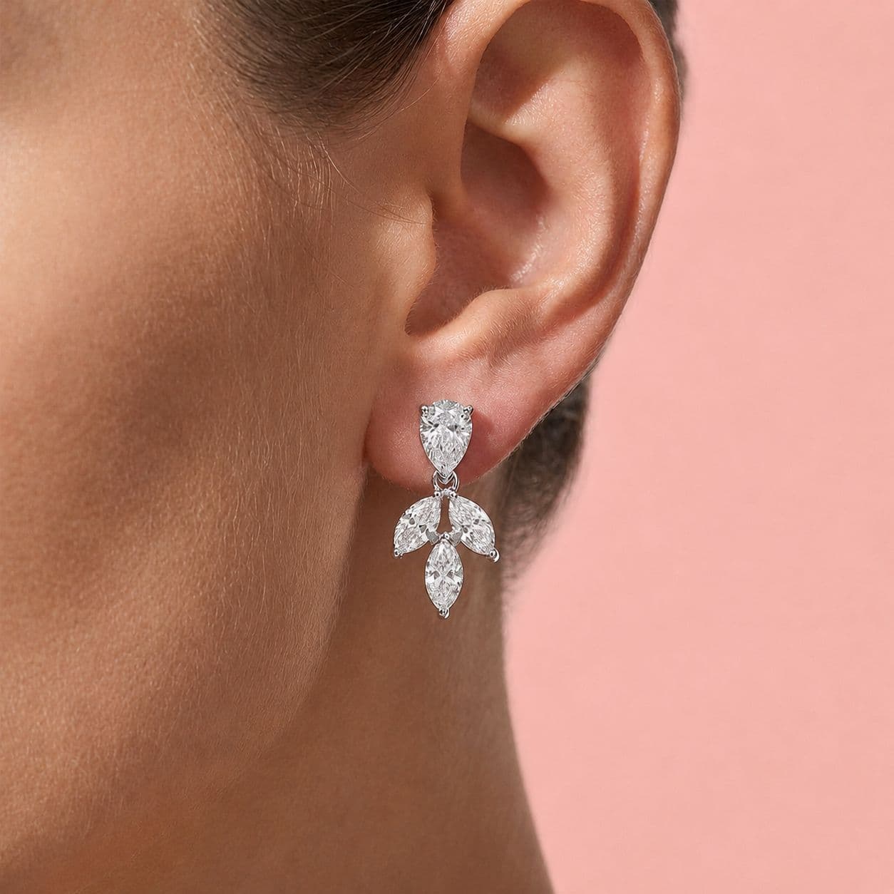 Diamond drop earrings, worn